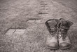 © giideon - Old boots next to an empty path