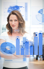 Poster - Confident blonde businesswoman using chart interfaces