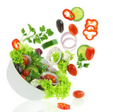 Fototapeta Fototapety do kuchni - Fresh mixed vegetables falling into a bowl of salad