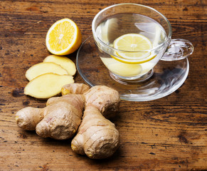 Sticker - a cup of ginger tea on a wooden table