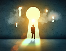 Silhouette Of Businessman In Keyhole