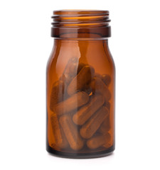 Wall Mural - Herbal drug capsules in brown glass bottle. Alternative medicine