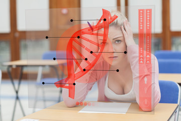 Poster - Blonde woman thinking hard while studying on futuristic interfac