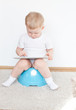 little boy on potty with tablet pc