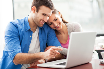 Sticker - couple looking at laptop