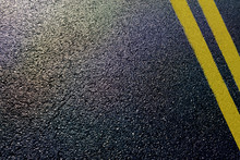 Asphalt Detail With Yellow Double Line