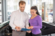 © ikonoklast_hh - Happy couple with car key in dealership