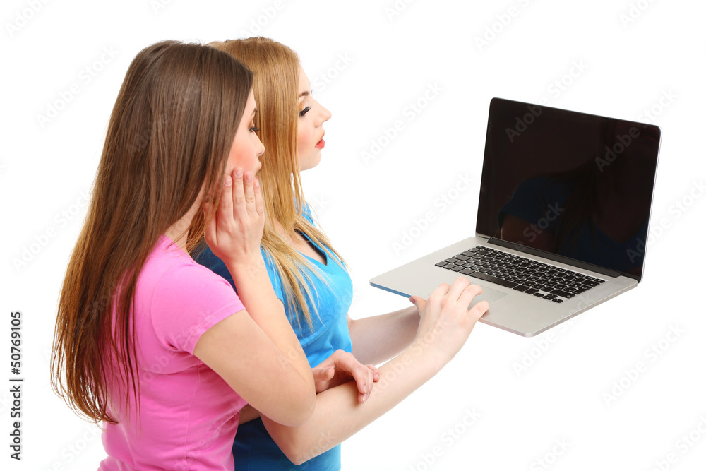 Two girl friends with with laptop isolated on white