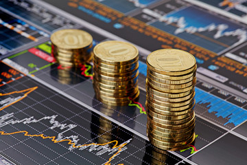 Uptrend stacks coins,on the financial stock charts as backgrou