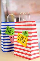 Striped bags on bright background