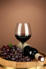 Composition of wine bottle, glass of red wine, grape