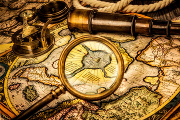 vintage magnifying glass lies on the ancient map of the north po
