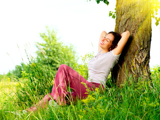 Wall Mural - beautiful young woman relaxing outdoors. nature