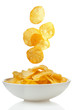 Potato chips falling in a bowl
