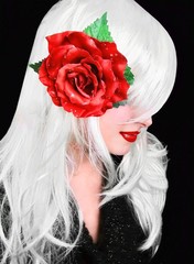 Wall Mural - Pretty woman with red rose flower hair clip