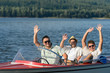 © CandyBox Images - Cheerful young guys partying in speed boat