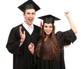 Wall Mural - Two happy graduating students  isolated on white