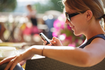 Happy woman reading smart phone