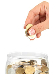 Poster - Saving, female hand putting a coin into glass bottle, isolated