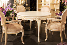 Table And Chairs In Classic Style In Furniture Store
