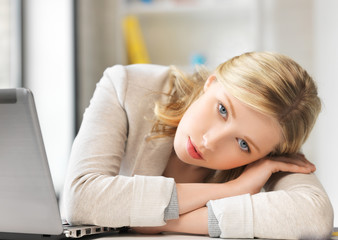 bored and tired woman behind the table