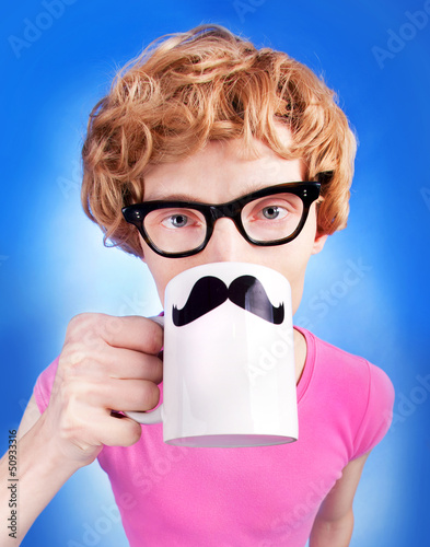 Fototapeta na wymiar Funny nerdy guy drinking tea