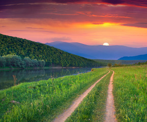 Wall Mural - Beautiful summer landscape on the mountain river. Sunrise