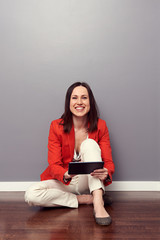 Poster - smiley student sitting on the floor