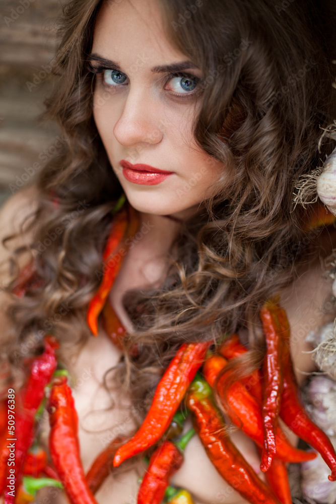 Young naked sexy girl in a necklace of red chili peppers Stock Photo Adobe Stock