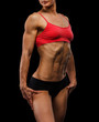 © Nobilior - Muscular strong woman on a black background