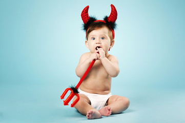 Wall Mural - little funny baby with devil horns and trident