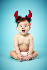 Wall Mural - little funny baby with devil horns