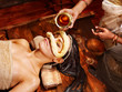 Woman having mask at ayurveda spa.