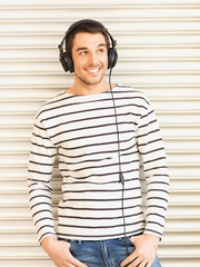 Poster - man in casual clothes with headphones