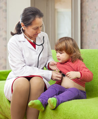 Wall Mural -   doctor examining 2 years baby with  phonendoscope