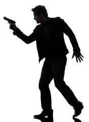 man killer policeman holding gun walking silhouette