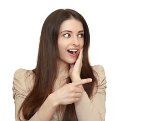 Surprising woman showing finger on empty space isolated on white