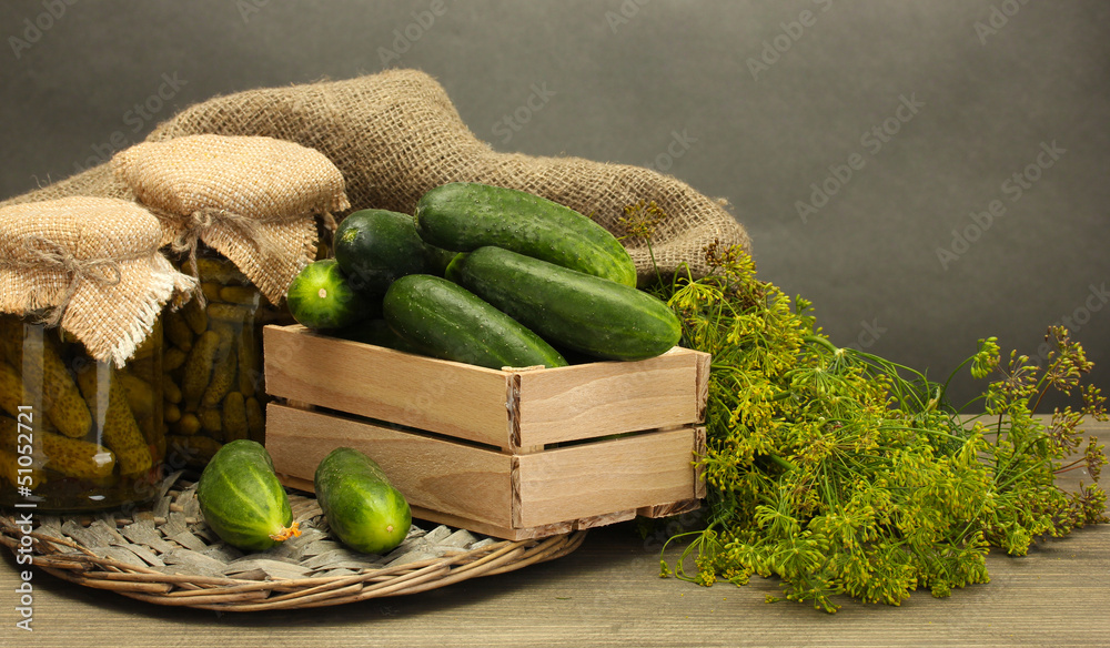fresh cucumbers in wooden box, pickles and dill,