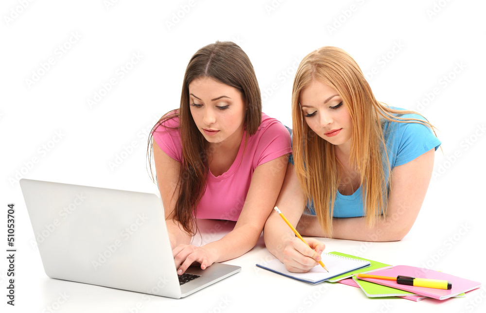 Two girl friends with with laptop isolated on white