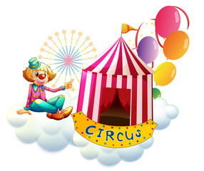 Wall Mural - A clown beside a circus tent with balloons