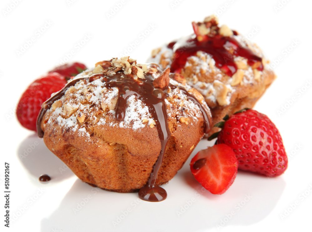 Tasty muffin cakes with strawberries and chocolate, isolated