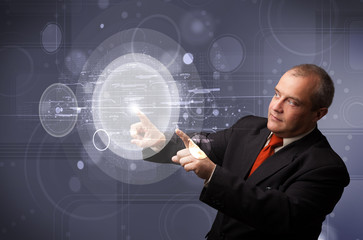 Businessman touching abstract high technology circular buttons