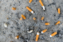 Many Ready Smoked Cigarettes Butt Stick In Sand