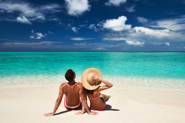 Wall Mural - Couple on a beach at Maldives