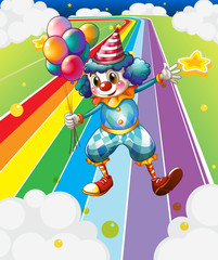 Wall Mural - A clown with balloons at the colorful street