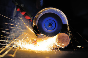 Wall Mural - Worker cutting metal with grinder