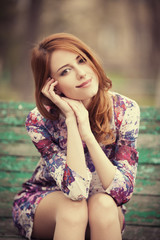 Sticker - Style redhead girl sitting on the bench