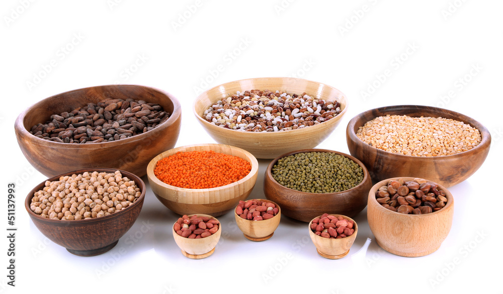 Different kinds of beans in bowls isolated on white