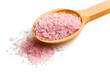 pink bath salt on wooden spoon