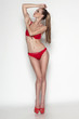 © paffy - Sexy woman in red bikini in full length posing